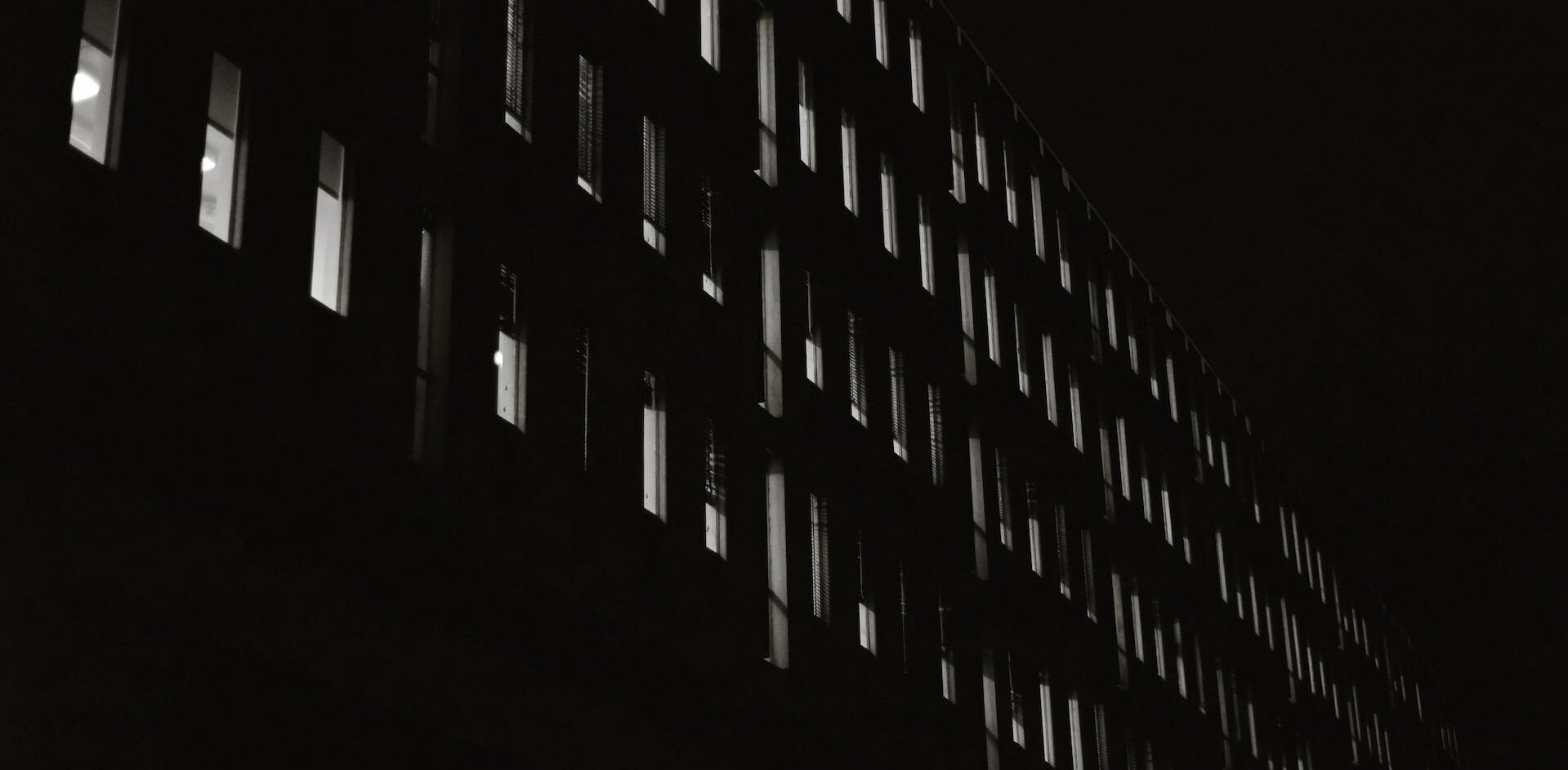 A corporate building's windows at night